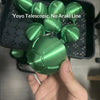 A hand holds a green Yoyo Telescopic No Araki Line fidget toy, which is a steel ball run stress relief toy.