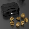 A black rectangular box containing a set of gold-colored LED glow dice for tabletop gaming.