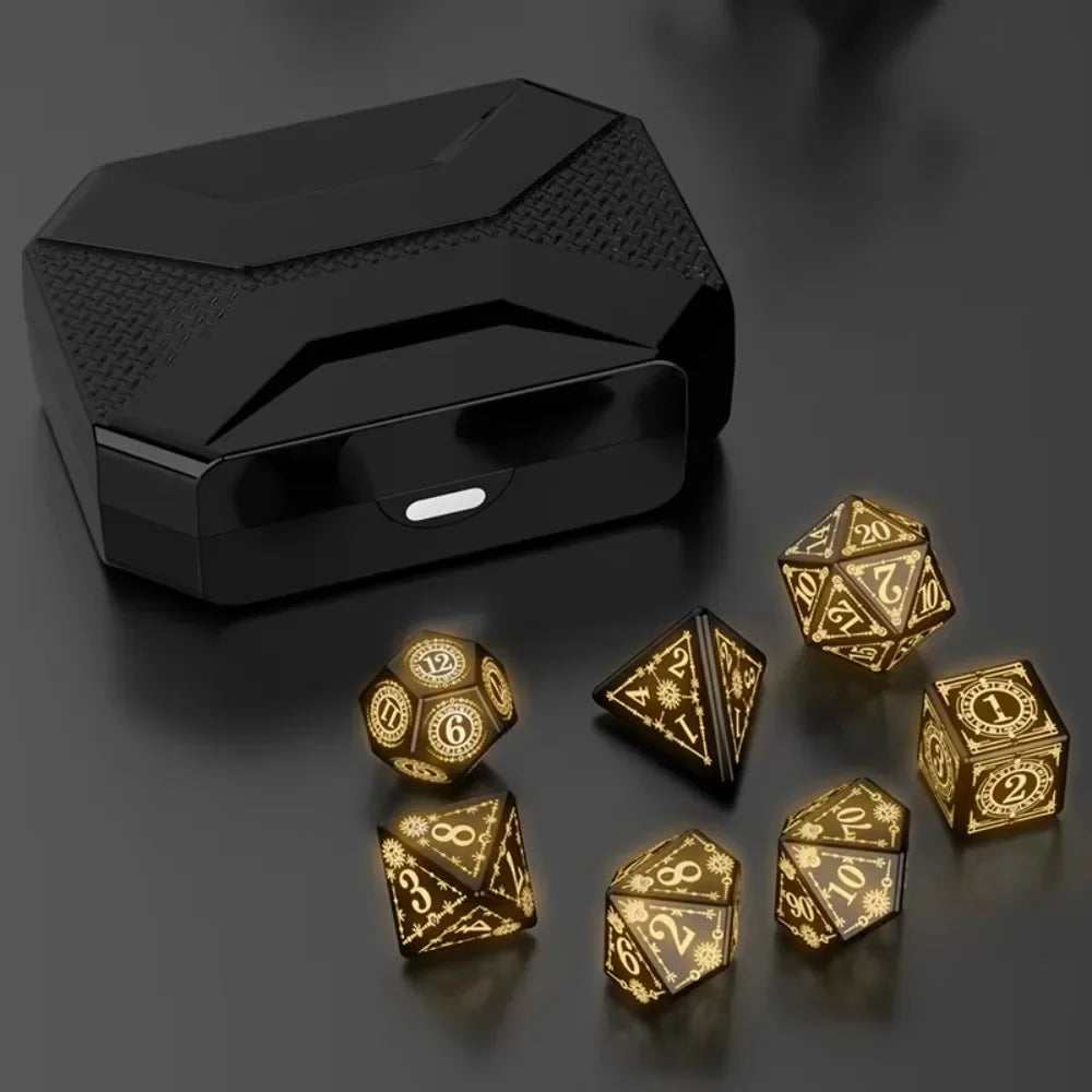 A black rectangular box containing a set of gold-colored LED glow dice for tabletop gaming.