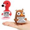 Handmade crochet owl figures in red and brown colors with inspirational text
