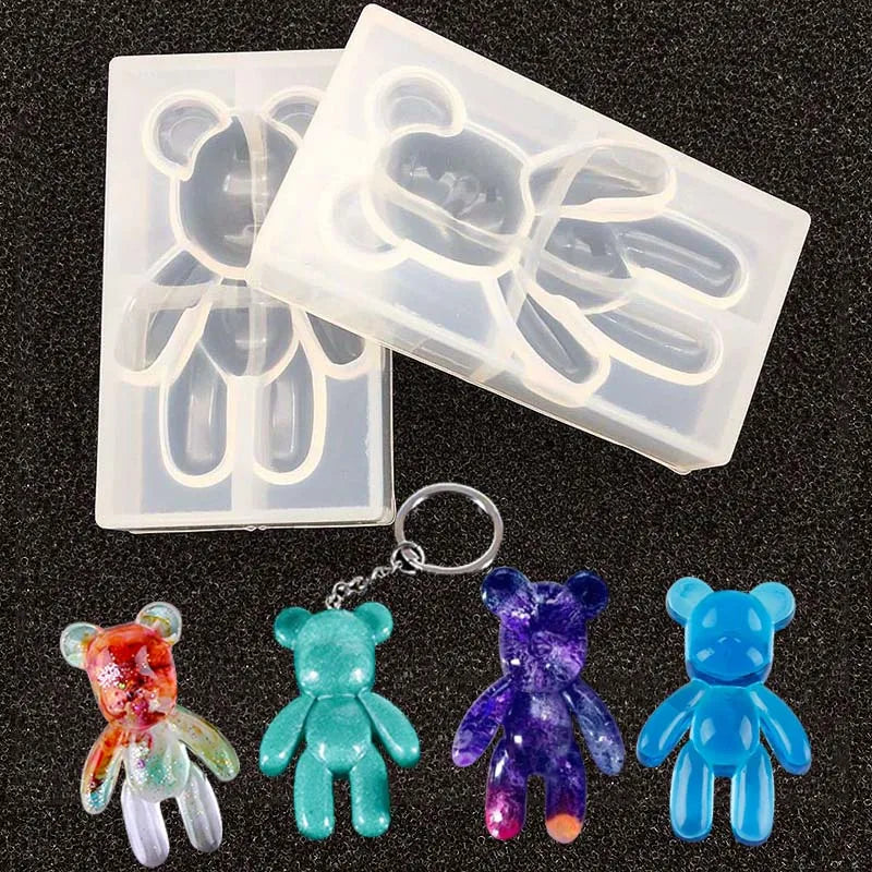 A set of silicone molds shaped like bears for resin jewelry and crafts, including various colors.