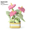 A set of pink and green floral building blocks shaped like hearts and leaves, assembled into a bouquet display.