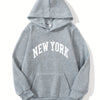 A gray pullover hoodie with the words NEW YORK printed in white across the chest.