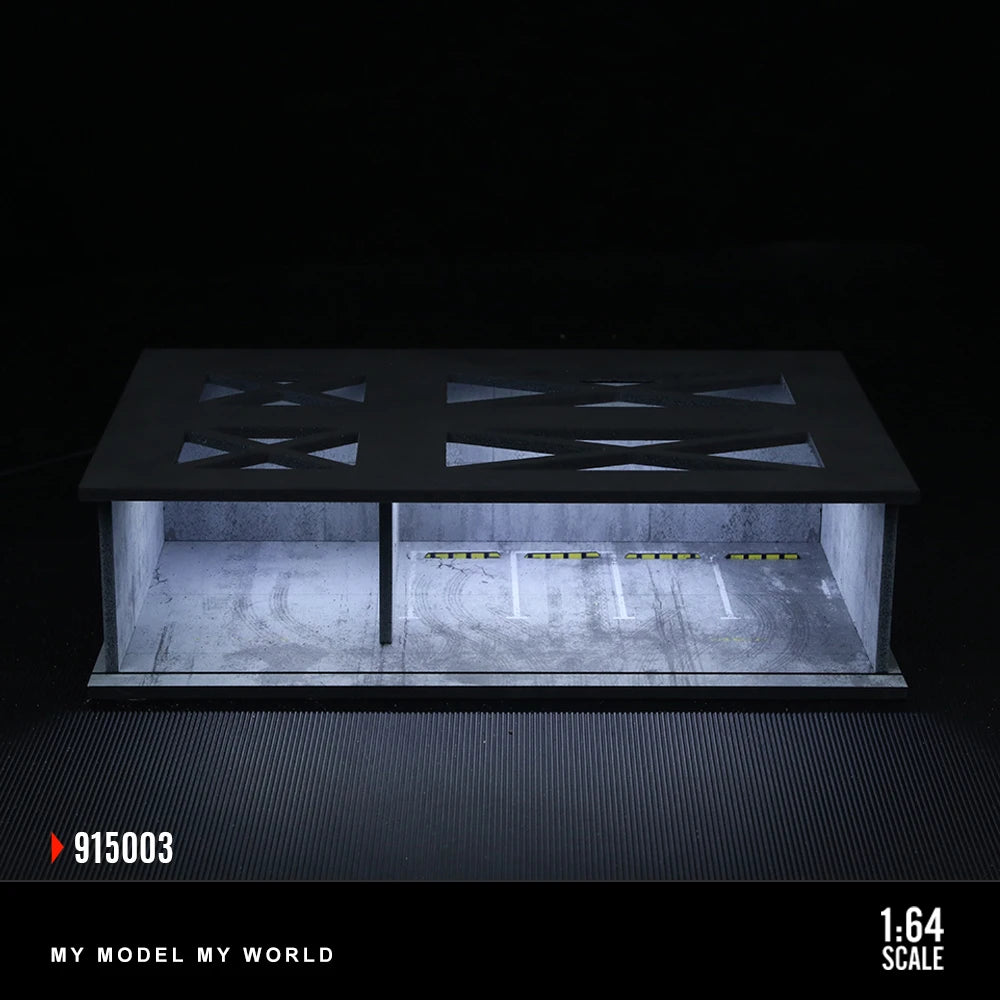 A 1:64 scale LED light-up underground garage diorama featuring a black display box with illuminated interior and a dark surfa