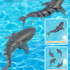 A remote control swimming shark toy demonstrates automatic swimming and eight-line activity in blue water.