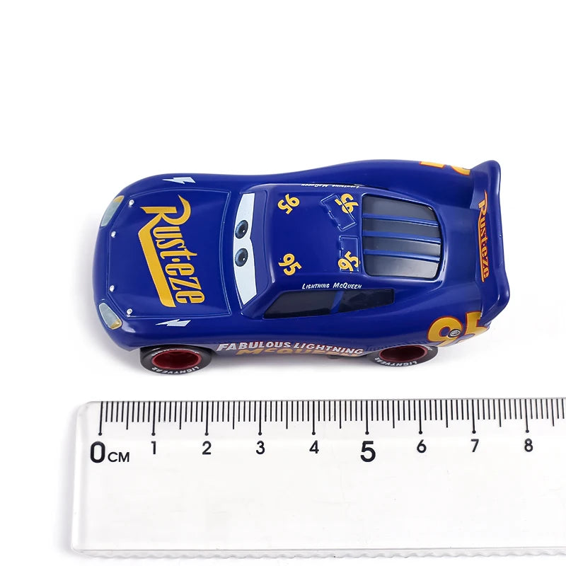 A blue diecast toy hauler truck featuring the Rust-eze logo and lightning effects.