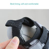 Close-up of a black mesh lined toddler shoe showing the detail display and soft construction.