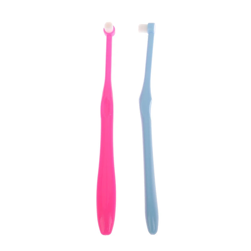 A pair of pink and light blue orthodontic interdental brushes for cleaning teeth.