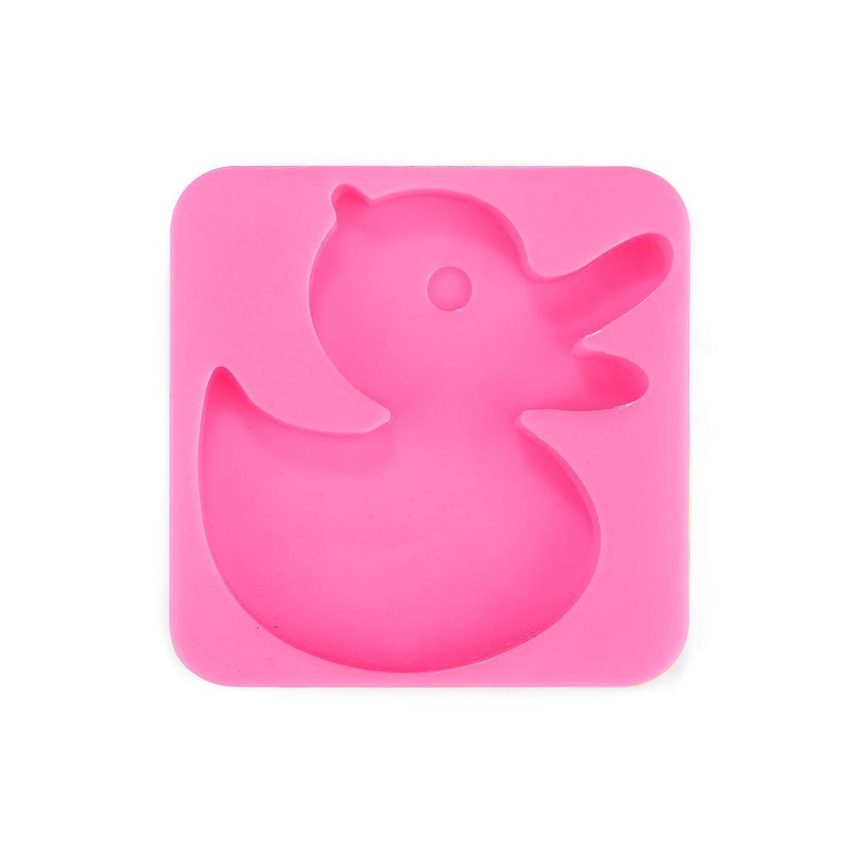 A pink silicone mold shaped like a duck for a DIY craft kit.