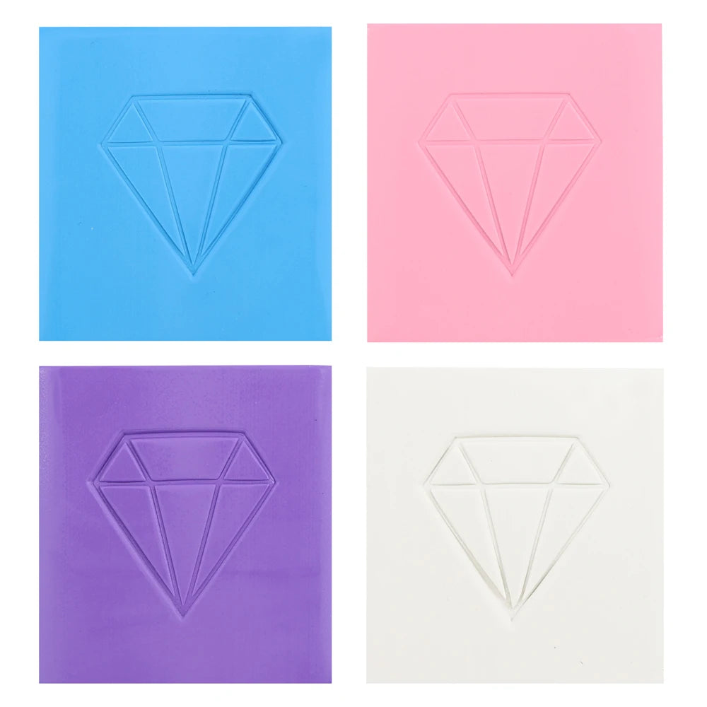 Four blocks of diamond painting clay in blue, pink, purple, and white showing a diamond shape.