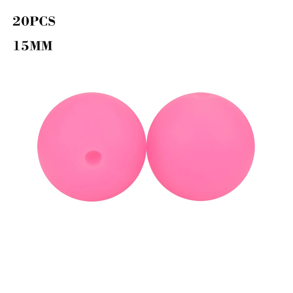 Two bright pink silicone beads, 15mm in size, for jewelry making.