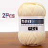 A ball of light yellow soft chunky t-shirt yarn for crochet and knitting, packaged as a 2-pack.