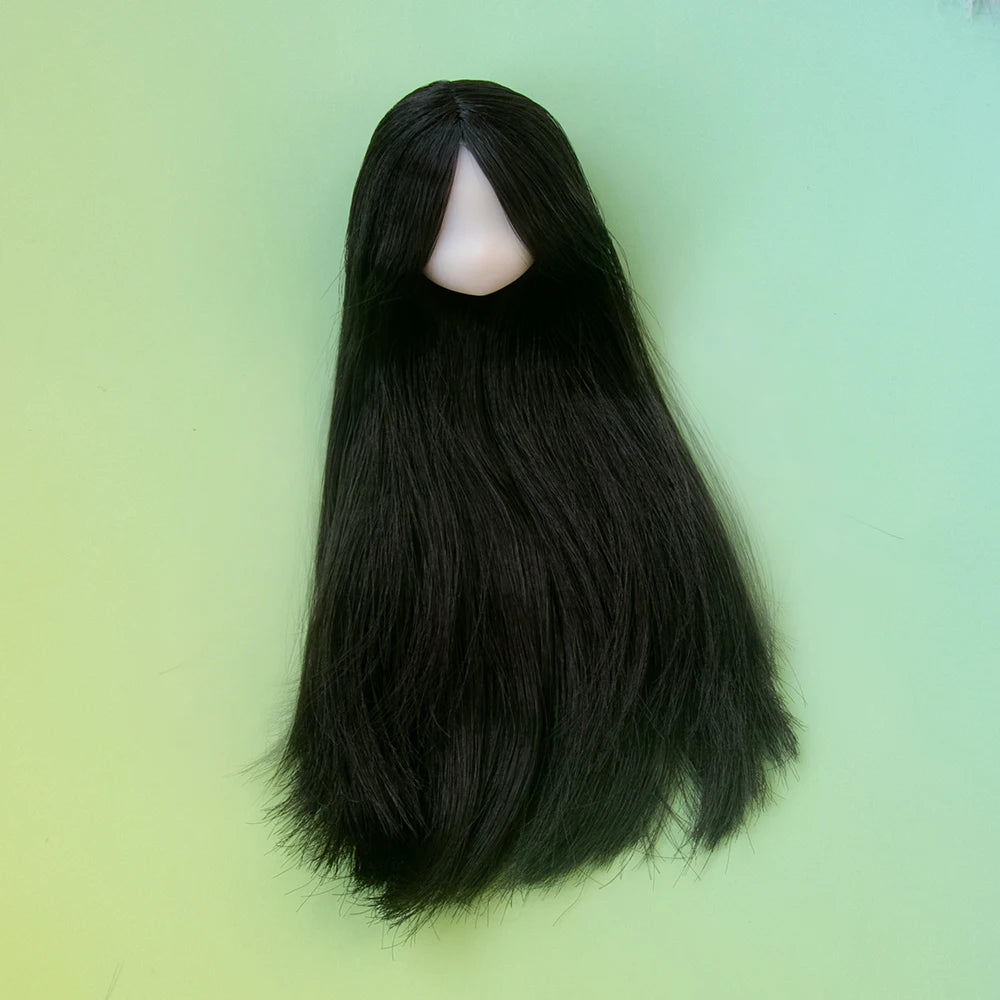 A long, straight black hair doll with a visible face and bangs against a light green background.