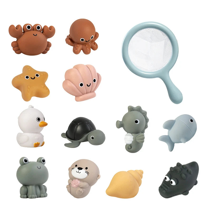 A collection of various silicone bath toys shaped like sea creatures including turtles, seals, and other marine animals.