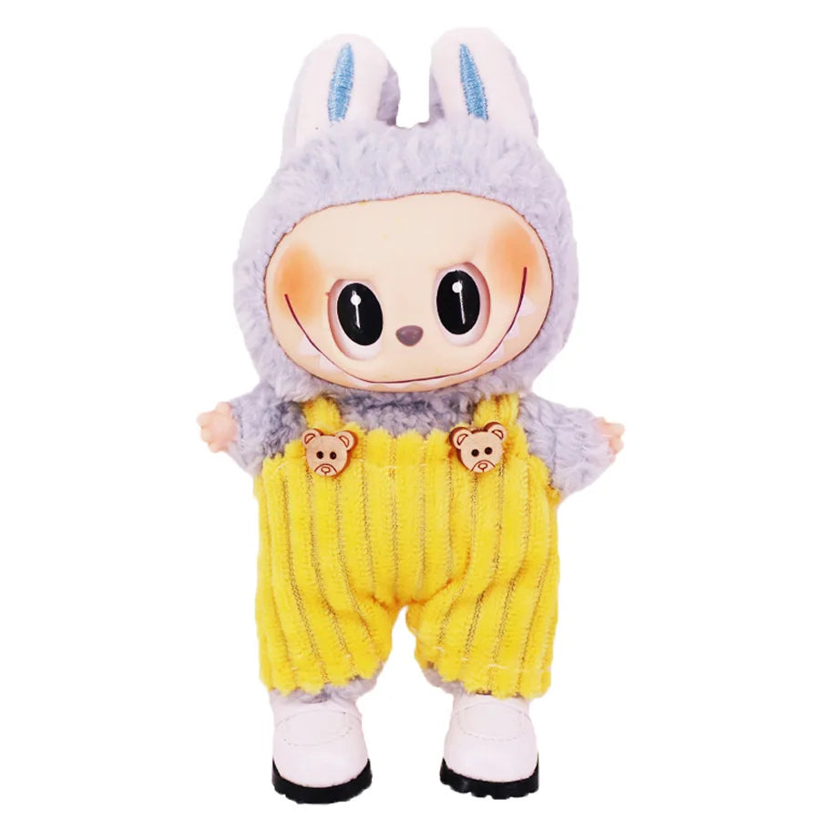 A plush doll resembling a rabbit wearing purple and yellow striped strap pants