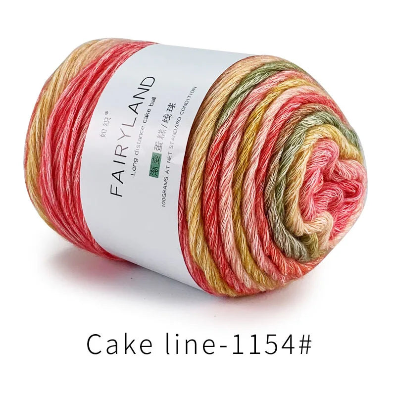 Spool of long distance cake ball gradient rainbow yarn for knitting and crochet