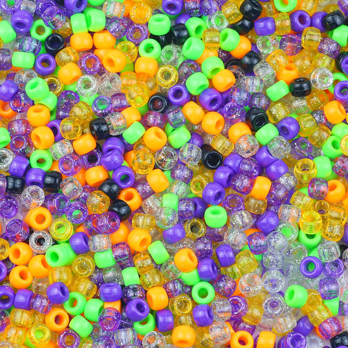 A close-up view of a large pile of multicolor pony beads in various shades of orange, yellow, green, purple, and black.