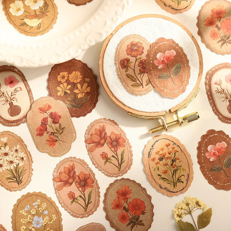 A collection of vintage floral stickers in earthy tones and muted colors for scrapbooking and journaling.