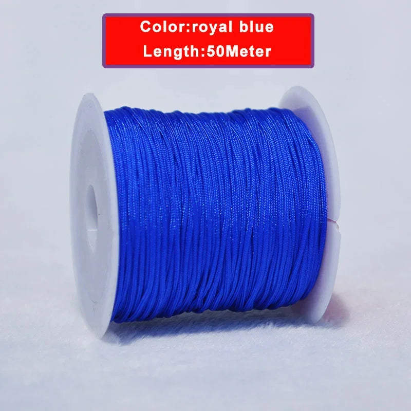 A spool of royal blue nylon knotting cord for jewelry making, 50 meters long.