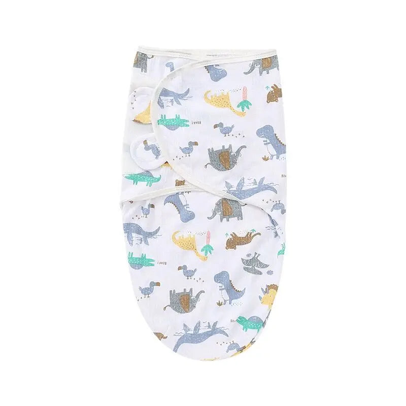 A white cotton newborn swaddle blanket and hat set featuring various animal designs.