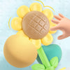 A collection of yellow and beige bath shower sprinkler toys for kids, including a central disc and surrounding spheres.