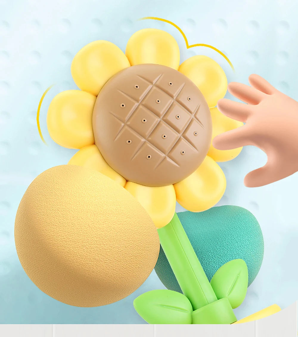 A collection of yellow and beige bath shower sprinkler toys for kids, including a central disc and surrounding spheres.