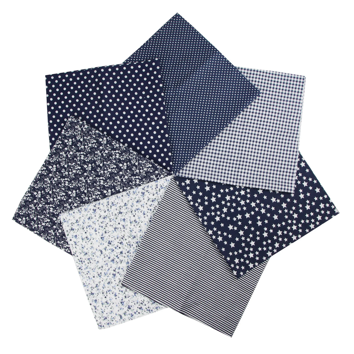 A collection of seven dark blue and white patterned cotton fabric squares for quilting and patchwork