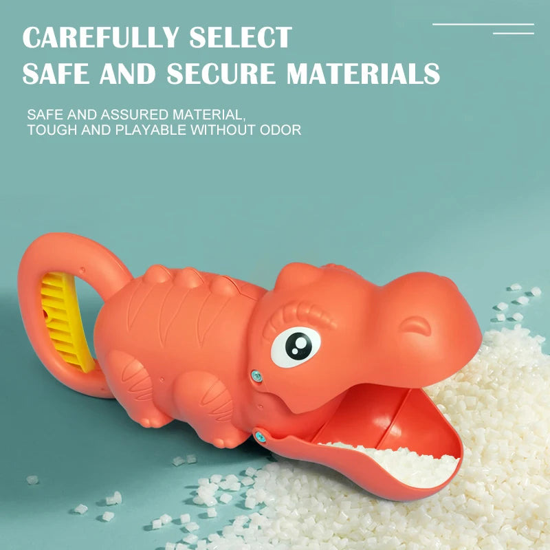 An orange dinosaur toy is shown next to white sand and small plastic pieces.