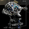 A detailed mechanical model kit of a dragonfly, featuring intricate silver and blue components on a black base.