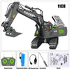A black remote control excavator toy with a yellow and green body and a hydraulic arm is shown alongside its accessories.