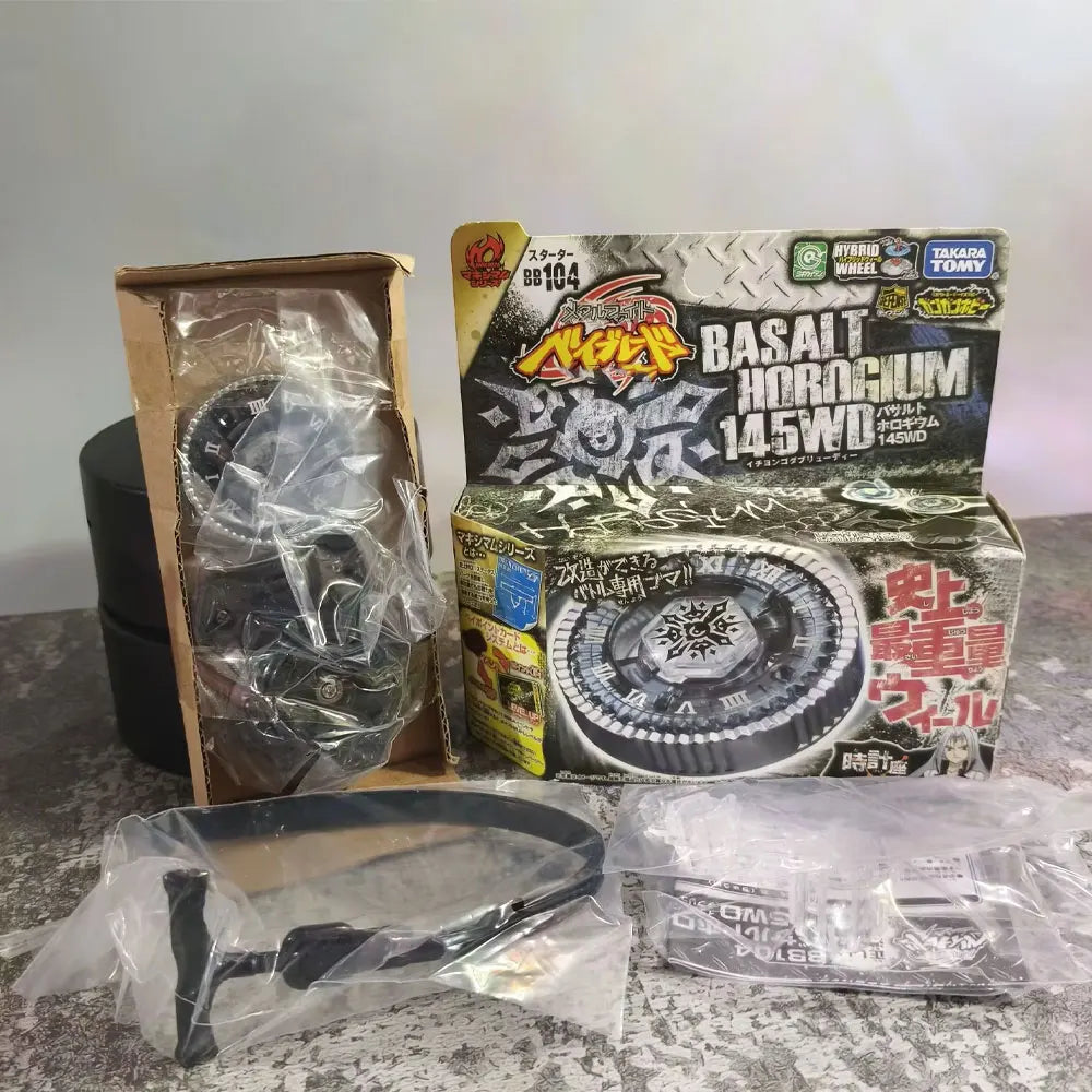 A boxed model kit of a Basalt Horogium toy from Takara Tomy Gravity Perseus featuring a black mechanical device and accessori