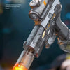 A close-up of a futuristic electric water gun firing a bright yellow stream of liquid and light effects.