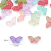 A collection of colorful glass butterfly beads in various shades and sizes for jewelry making.