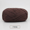 A ball of dark brown pre-dyed milk cotton yarn, 5-ply blended, used for knitting and crochet.