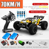 A black brushless 4WD monster truck RC car is shown with various upgrades and accessories.