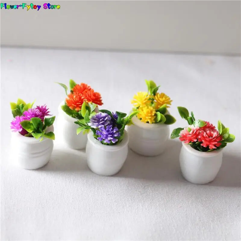 A collection of miniature green plant pots filled with colorful flowers for dollhouse decor