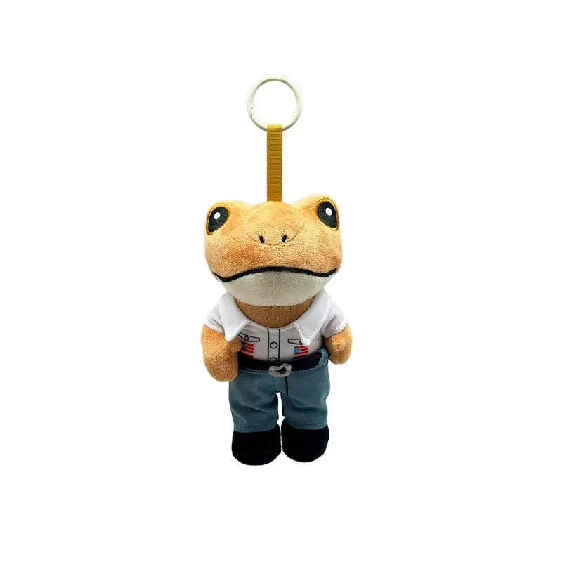 A cute plush frog doll with a yellow body and white markings, wearing blue pants and a belt.