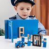 A young boy is playing with a blue wooden building tool set for pretend play construction toys.