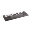 A black 37-key portable electric keyboard piano with a microphone for kids, shown from above.