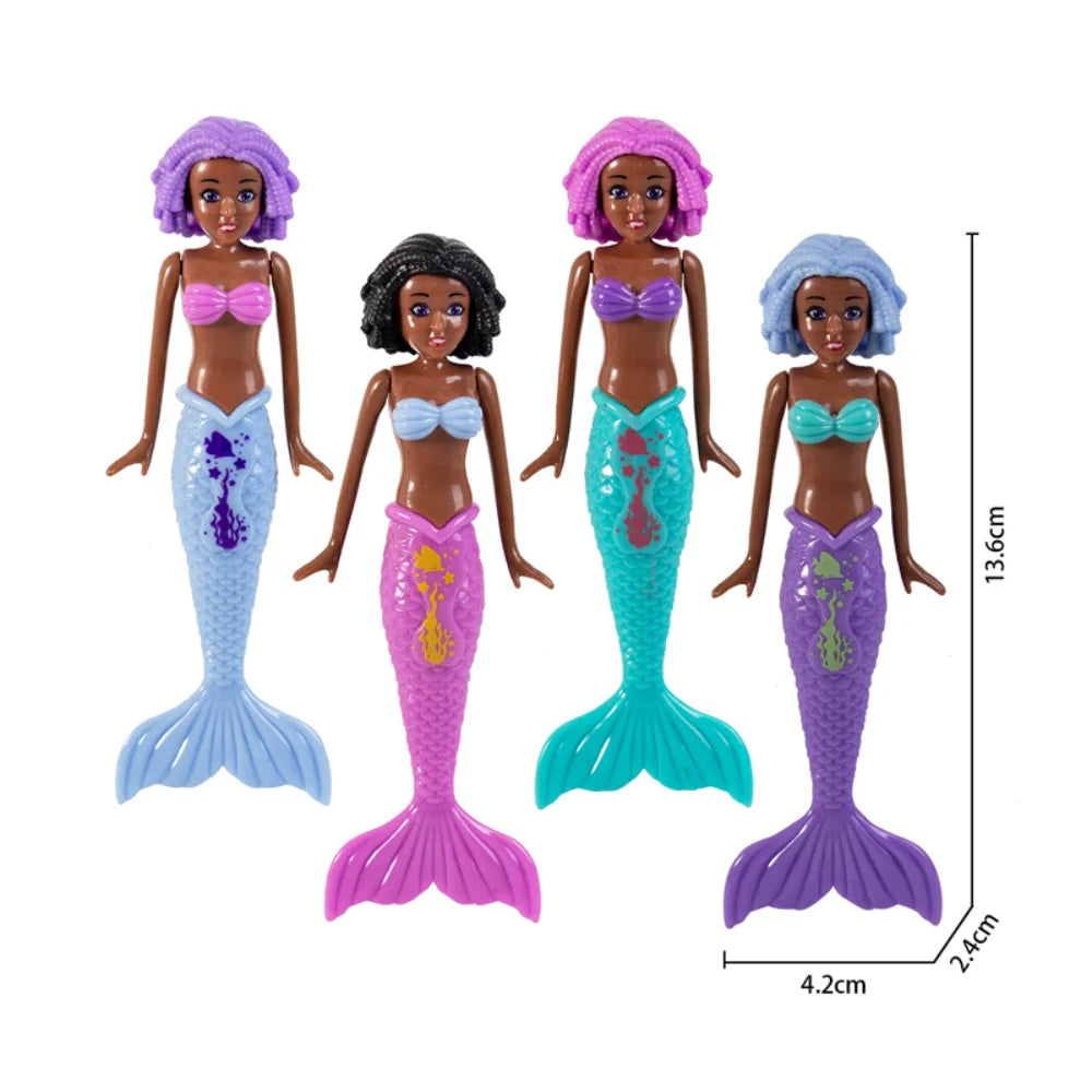 A set of four mermaid dive toys in purple, pink, and blue colors with iridescent tails.