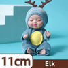 A cute elf-themed reborn baby doll with brown antlers and a yellow belly, shown against a light blue background.