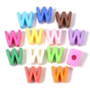 A collection of colorful acrylic alphabet beads shaped like the letter W in various shades and sizes.