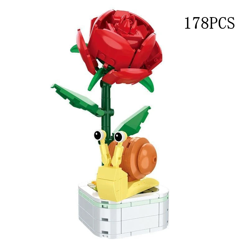 A set of 178 plastic building blocks shaped like red roses and a yellow flower bouquet.