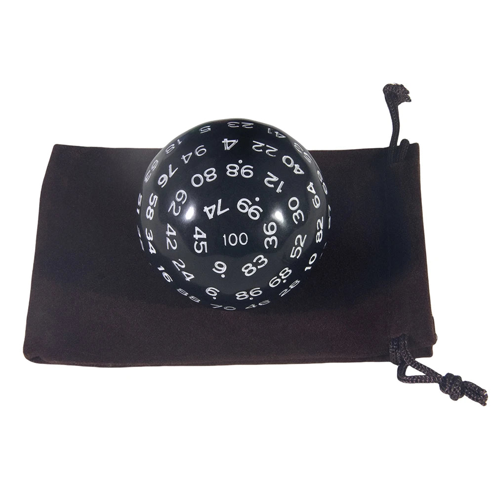 A black storage bag holds a 100-sided polyhedral die with numbered faces.