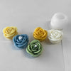 A collection of silicone molds shaped like roses in yellow, blue, green, and white for candle making or baking.