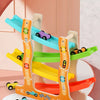 A wooden orbital gliding toy set featuring multiple colored tracks and vehicles for kids.