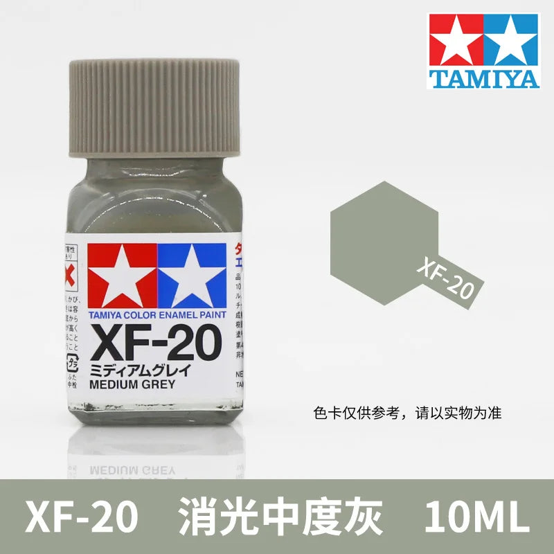 Tamiya XF-20 Medium Grey enamel paint in a glass bottle with a ribbed cap