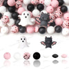 A variety of pink, white, and black silicone craft beads shaped like ghosts and bats are displayed on a white background.