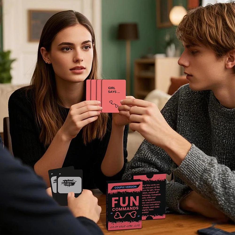 A woman and a man look at couples scratch-off challenge cards for romantic date nights on a wooden table.