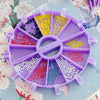 A purple 6-compartment diamond painting organizer tray filled with colorful sequins and beads.